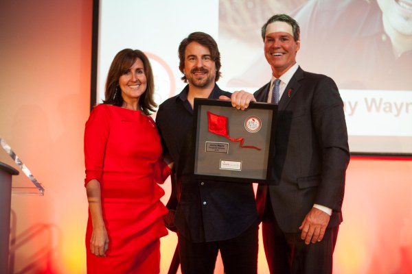 Jimmy Wayne, (center) is presented with the inaugural KiteTales Award by Annie Smith, State Director of Youth Villages North Carolina and Pat Lawler, Chief Executive Officer, Youth Villages.